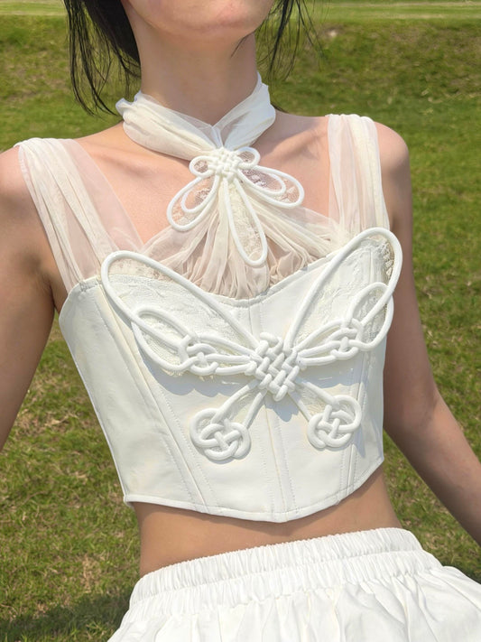 White 3D printed butterfly knot corset worn outdoors — lace and PU leather detail