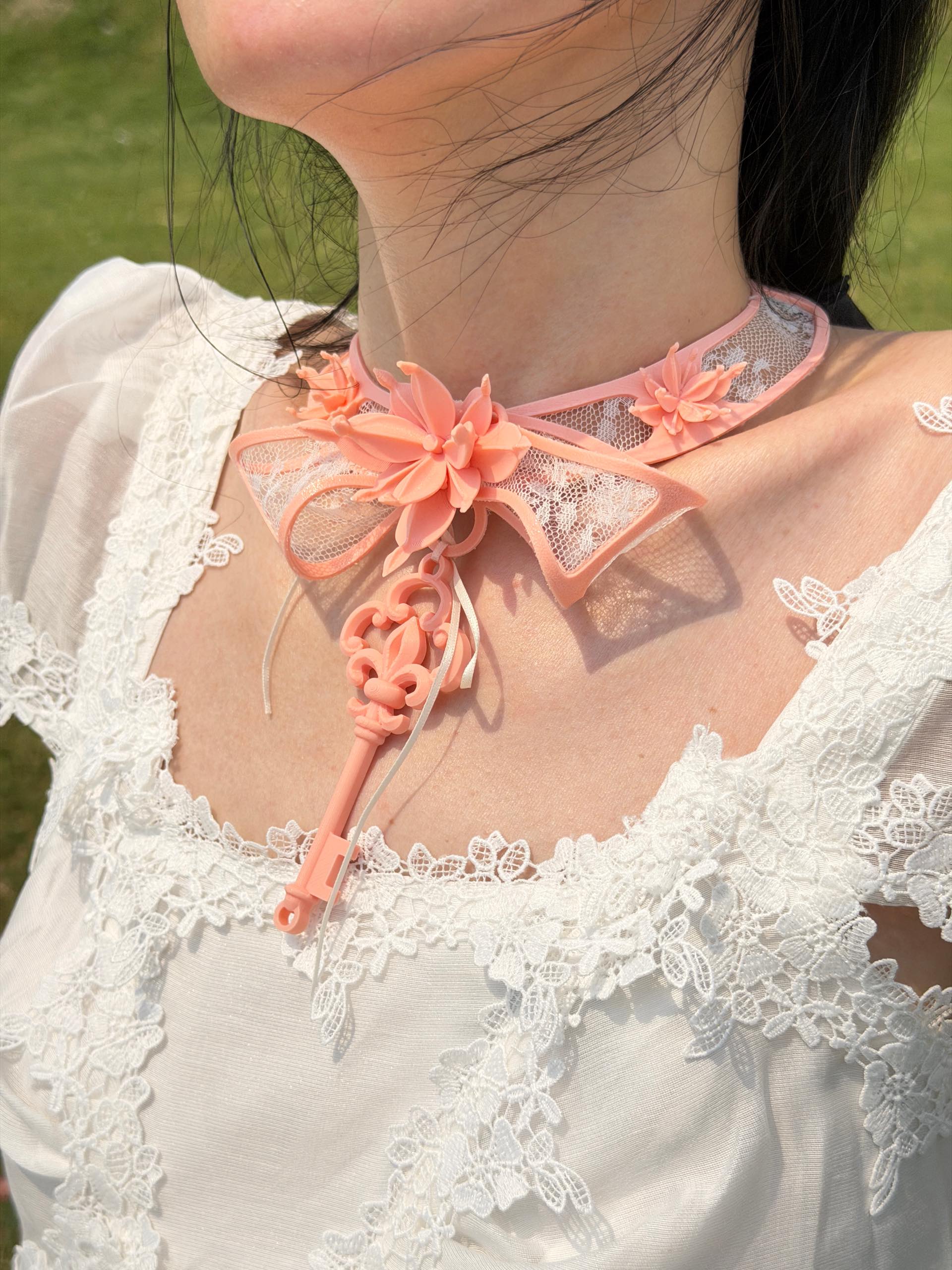 Pink skeleton key pendant choker with 3D printed blossoms — detail shot