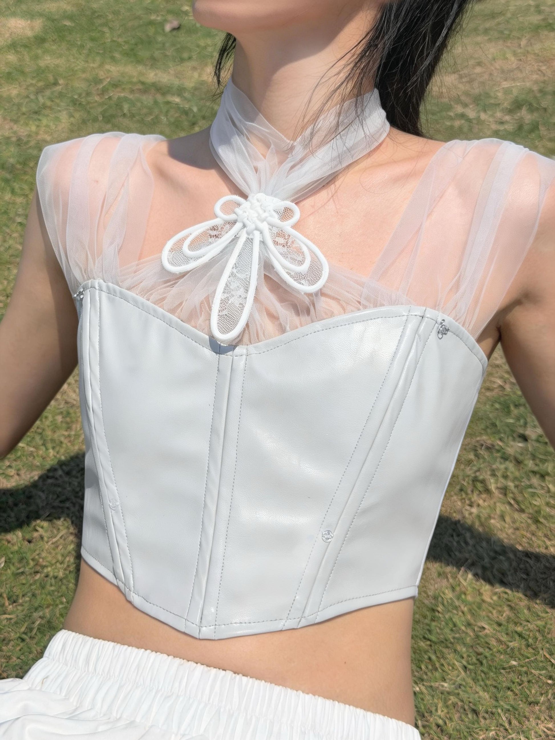 Silver corset with 3D printed tulle neck bow — minimalist styling