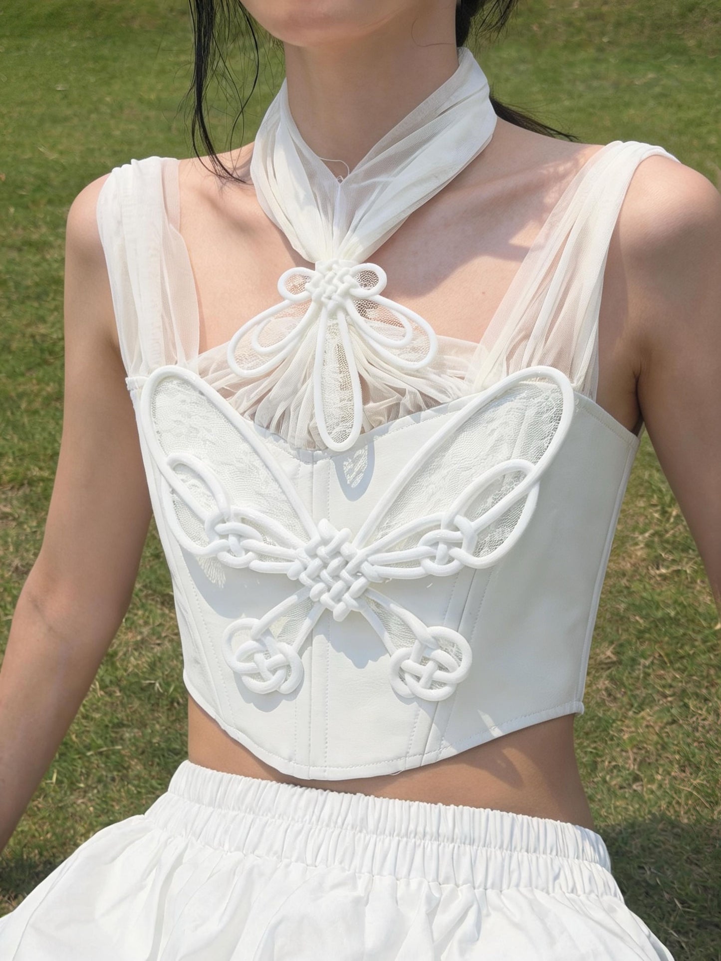 White Butterfly Knot Corset with 3D printed lace-up knots and tulle neck bow — front close-up